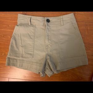 High-waisted khaki shorts by H&M